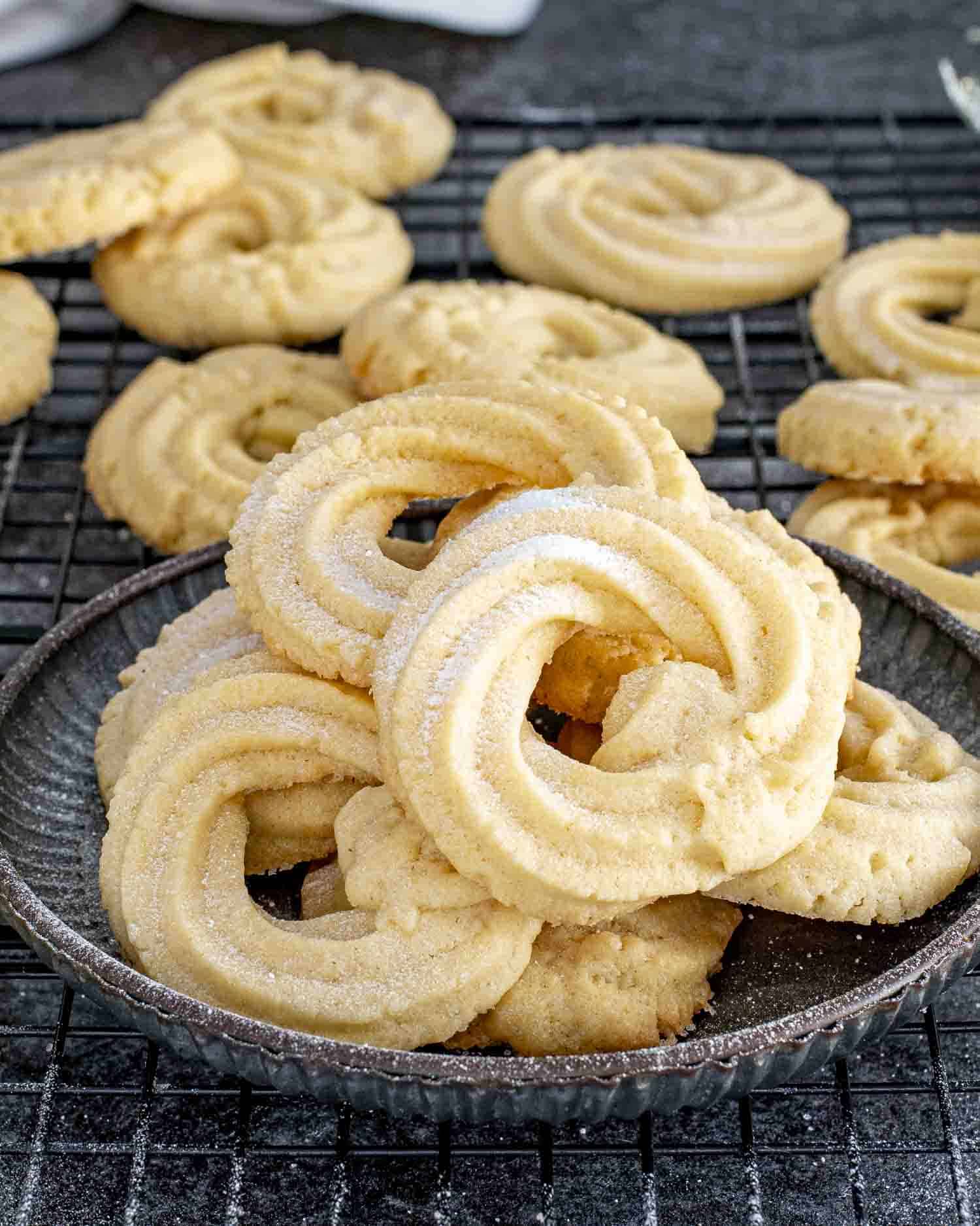 a few freshly baked danish cookies on a plate.