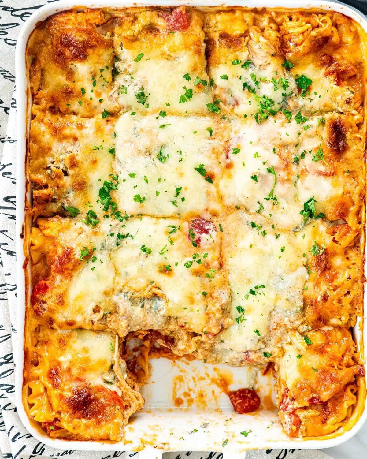 Buffalo Chicken Lasagna overhead shot of Buffalo Chicken Lasagna in a white casserole dish