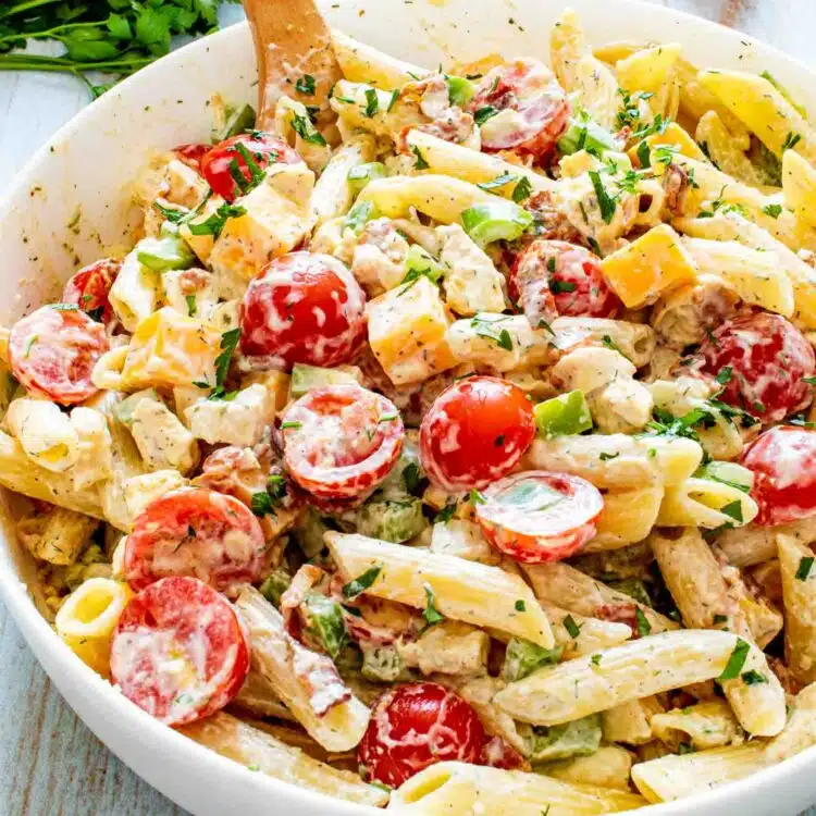 chicken club pasta salad in a white bowl.