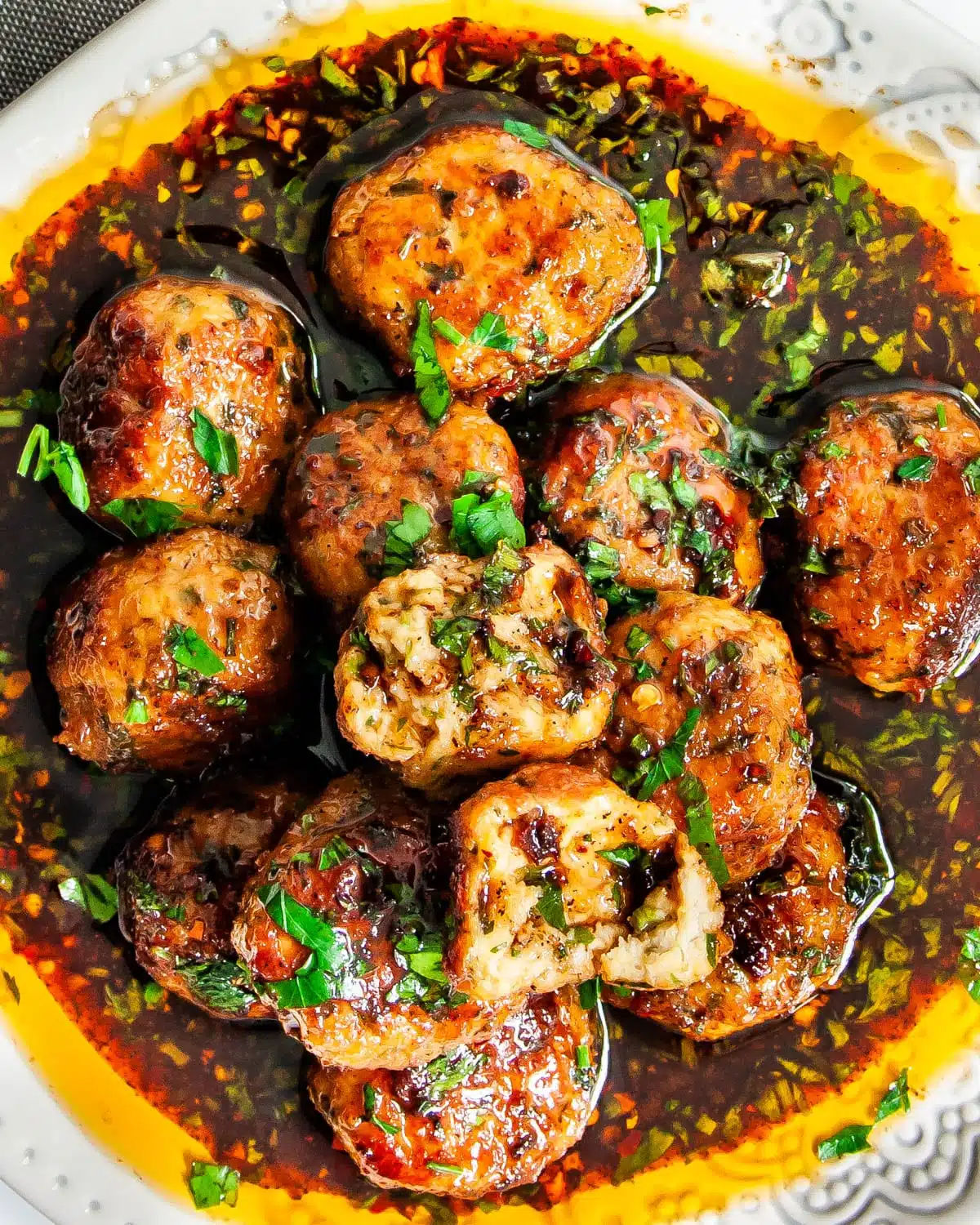 Firecracker Chicken Meatballs overheat shot of firecracker chicken meatballs smothered in sauce