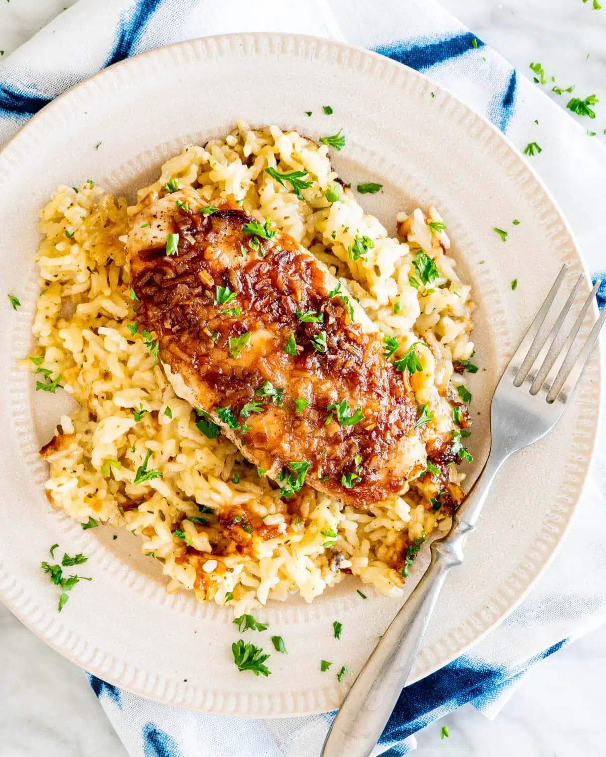 No Peek Chicken Rice Casserole overhead shot of No Peek Chicken Rice Casserole in a white plate