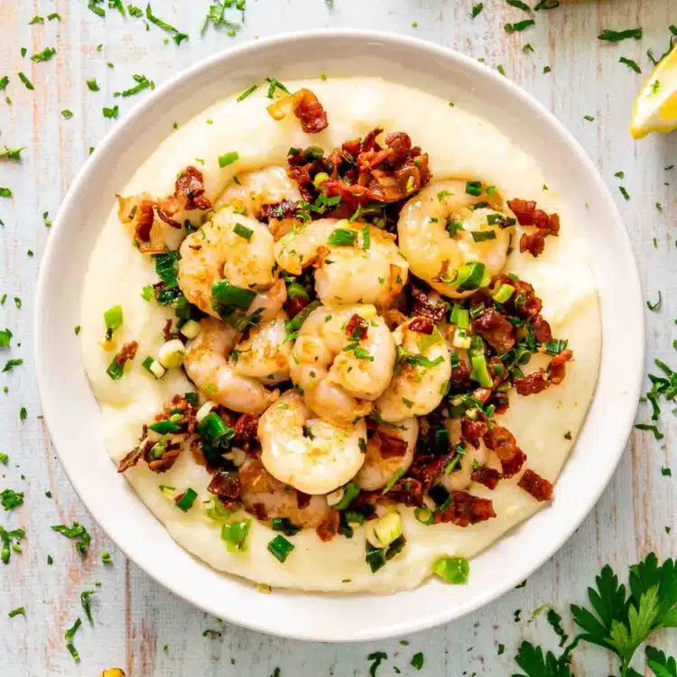 shrimp and grits in a white bowl.